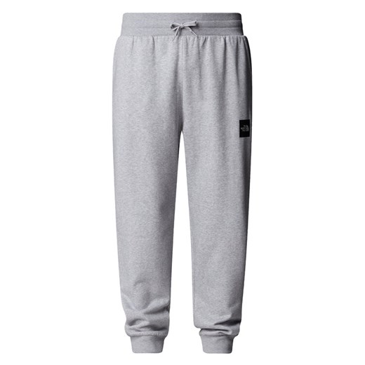 The North Face Spodnie dresowe Fine NF0A8C1K Szary Tapered Fit ze sklepu MODIVO w kategorii Spodnie męskie - zdjęcie 185833601