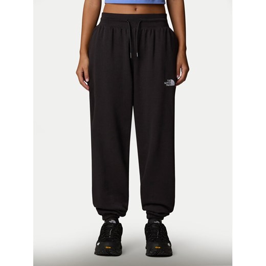 The North Face Spodnie dresowe Essential NF0A8C1G Czarny Relaxed Fit ze sklepu MODIVO w kategorii Spodnie damskie - zdjęcie 185834012