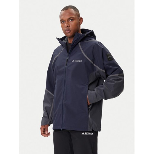 adidas Kurtka przeciwdeszczowa Nat Geo Climaproof KC2343 Granatowy Loose Fit ze sklepu MODIVO w kategorii Kurtki męskie - zdjęcie 185913660