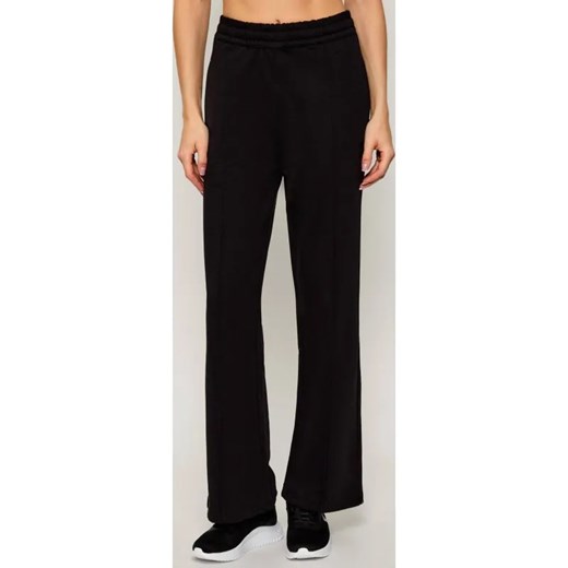 Calvin Klein Jeans Spodnie dresowe | flare fit ze sklepu Gomez Fashion Store w kategorii Spodnie damskie - zdjęcie 185998904