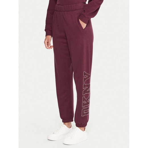 DKNY Sport Spodnie dresowe DP5P3737 Bordowy Regular Fit ze sklepu MODIVO w kategorii Spodnie damskie - zdjęcie 186030840