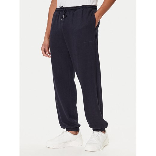 Tommy Hilfiger Spodnie dresowe UM0UM03627 Niebieski Regular Fit ze sklepu MODIVO w kategorii Spodnie męskie - zdjęcie 186030953