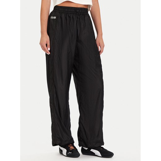 Puma Spodnie dresowe PUMA X ROSÉ T7 633796 01 Czarny Relaxed Fit ze sklepu MODIVO w kategorii Spodnie damskie - zdjęcie 186031440