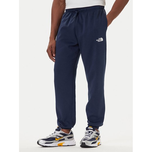 The North Face Spodnie dresowe Simple Dome NF0A8C1W Granatowy Regular Fit ze sklepu MODIVO w kategorii Spodnie męskie - zdjęcie 186031720