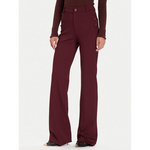 Guess Spodnie materiałowe W5BB16 KCMU2 Czerwony Flare Fit ze sklepu MODIVO w kategorii Spodnie damskie - zdjęcie 186032212