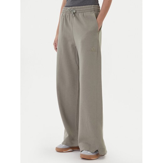 adidas Spodnie dresowe ALL SZN Fleece JY5014 Beżowy Wide Leg ze sklepu MODIVO w kategorii Spodnie damskie - zdjęcie 186140810