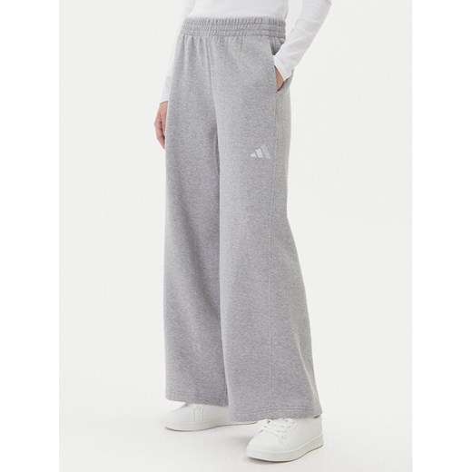 adidas Spodnie dresowe ALL SZN Holiday Glitter Fleece JV5758 Szary Loose Fit ze sklepu MODIVO w kategorii Spodnie damskie - zdjęcie 186151430
