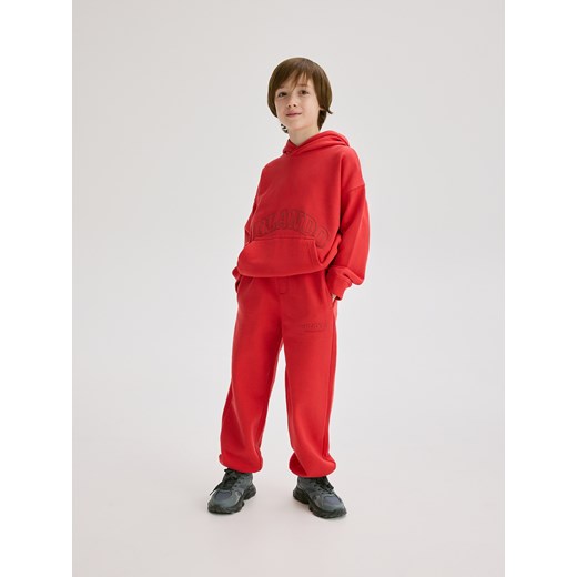 Reserved - Bawełniane spodnie jogger - czerwony ze sklepu Reserved w kategorii Spodnie chłopięce - zdjęcie 186169200