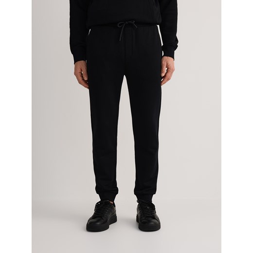 Reserved - Bawełniane spodnie dresowe - czarny ze sklepu Reserved w kategorii Spodnie męskie - zdjęcie 186177640