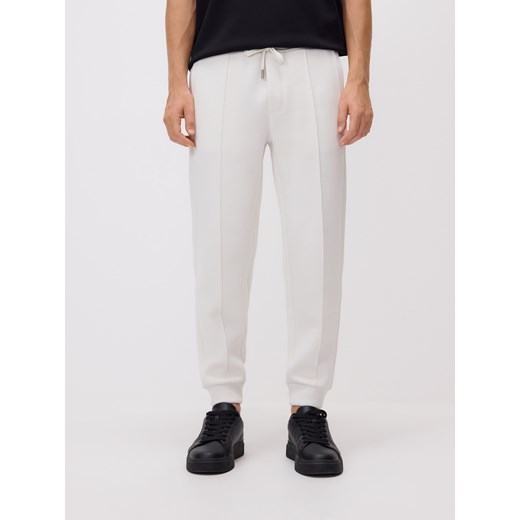 Reserved - Spodnie dresowe slim fit - złamana biel ze sklepu Reserved w kategorii Spodnie męskie - zdjęcie 186183650