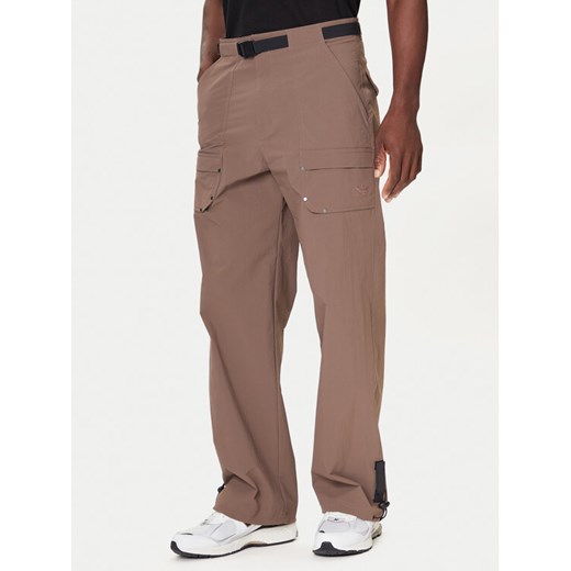 adidas Spodnie materiałowe Premium Essentials Archive Utility JW1082 Brązowy Loose Fit ze sklepu MODIVO w kategorii Spodnie męskie - zdjęcie 186186822