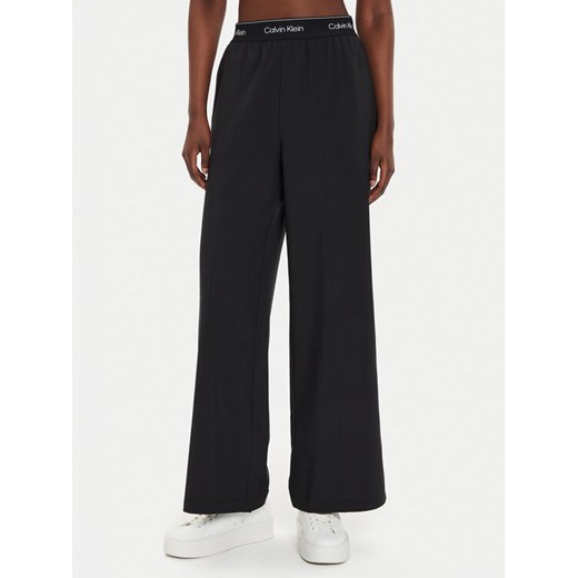 Calvin Klein Performance Spodnie dresowe 00GWF4P606 Czarny Wide Leg ze sklepu MODIVO w kategorii Spodnie damskie - zdjęcie 186200451