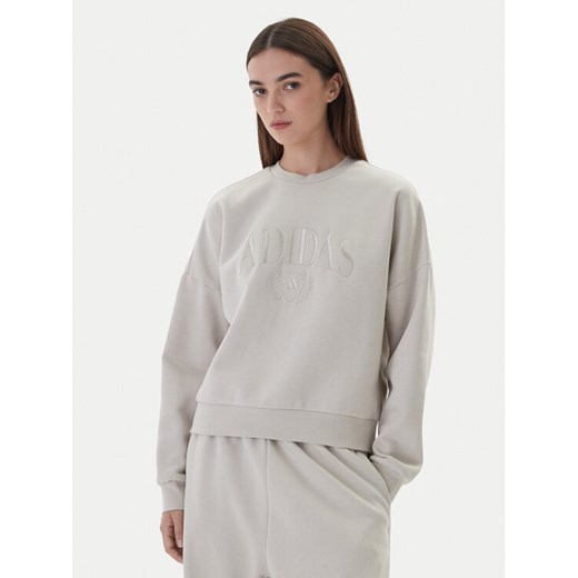 adidas Bluza Cozy Holiday Graphic KA9950 Beżowy Loose Fit ze sklepu MODIVO w kategorii Bluzy damskie - zdjęcie 186200512