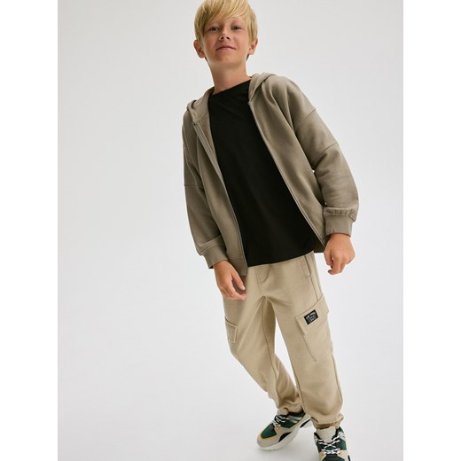 Reserved - Joggery cargo z kieszeniami - beżowy Reserved 122 (6-7 lat) wyprzedaż Reserved