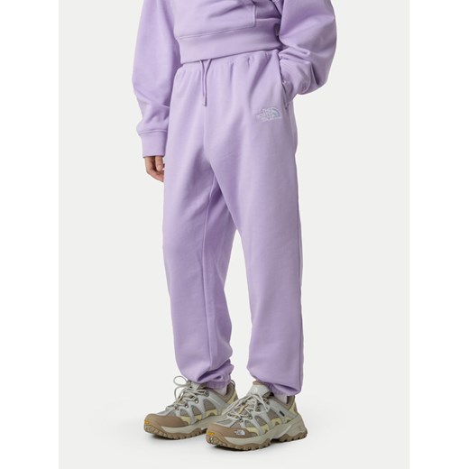 The North Face Spodnie dresowe Essential NF0A8BHS Fioletowy Regular Fit ze sklepu MODIVO w kategorii Spodnie dziewczęce - zdjęcie 186475330