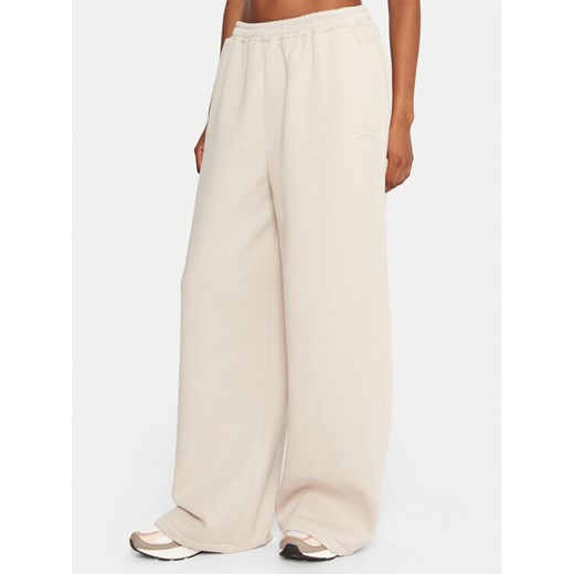 Reebok Spodnie dresowe Reebok X Ewa Chodakowska RK25306CCW Beżowy Regular Fit ze sklepu MODIVO w kategorii Spodnie damskie - zdjęcie 186498781