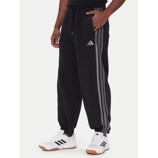 adidas Spodnie dresowe Ess JM1703 Czarny Regular Fit ze sklepu MODIVO w kategorii Spodnie męskie - zdjęcie 186567290