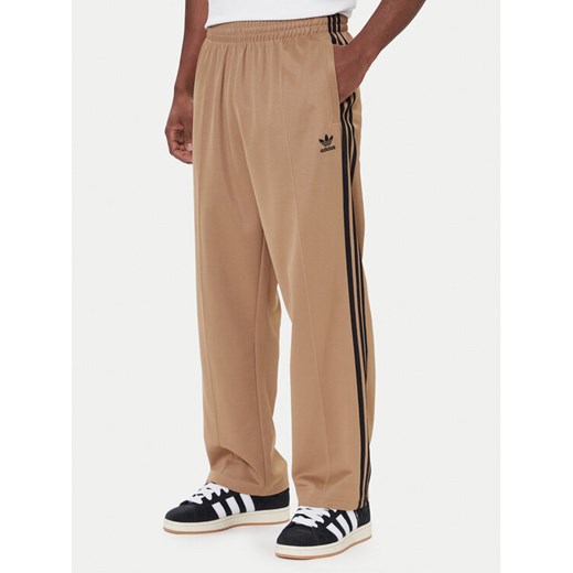 adidas Spodnie dresowe adicolor Firebird JY1419 Beżowy Baggy Fit L MODIVO