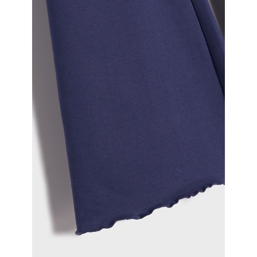 Sinsay - Spodnie dresowe flare - różowy Sinsay 116 (5-6 l) Sinsay