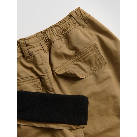Reserved - Ocieplane spodnie - beżowy ze sklepu Reserved w kategorii Spodnie chłopięce - zdjęcie 186742072