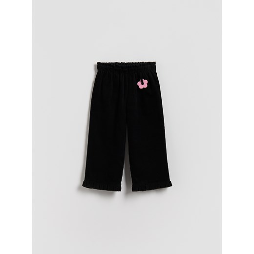 Reserved - Sztruksowe spodnie z zawieszką - czarny ze sklepu Reserved w kategorii Spodnie dziewczęce - zdjęcie 186759644