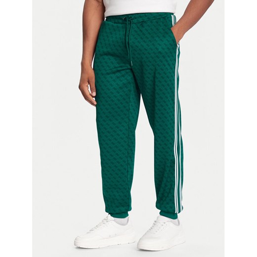 Guess Spodnie dresowe Z5BB19 K2042 Zielony Regular Fit ze sklepu MODIVO w kategorii Spodnie męskie - zdjęcie 186762813