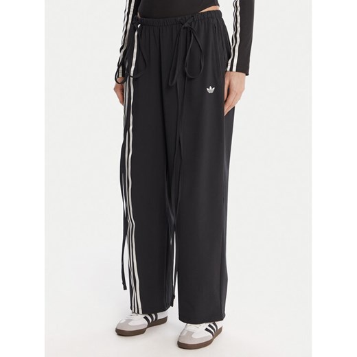 adidas Spodnie dresowe Ribbon Parachute JV9727 Czarny Loose Fit ze sklepu MODIVO w kategorii Spodnie damskie - zdjęcie 186806291