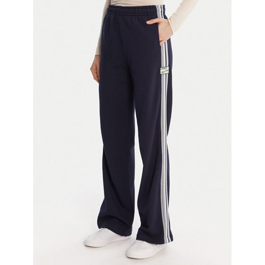 Lacoste Spodnie dresowe XF5250 Granatowy Regular Fit ze sklepu MODIVO w kategorii Spodnie damskie - zdjęcie 186812920