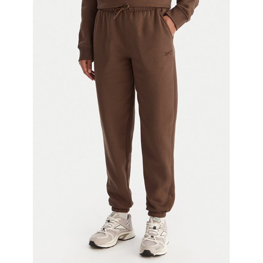 Reebok Spodnie dresowe Reebok X Ewa Chodakowska Evren RK25308CCW Brązowy Regular Fit ze sklepu MODIVO w kategorii Spodnie damskie - zdjęcie 186818261