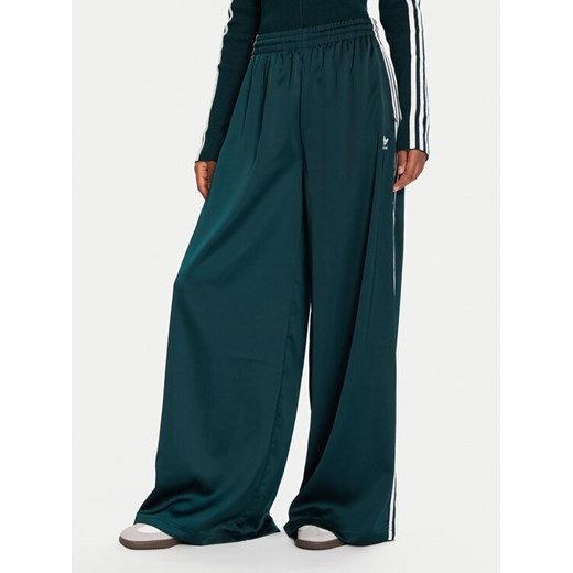 adidas Spodnie dresowe adicolor Satin JV7511 Zielony Wide Leg ze sklepu MODIVO w kategorii Spodnie damskie - zdjęcie 187052134