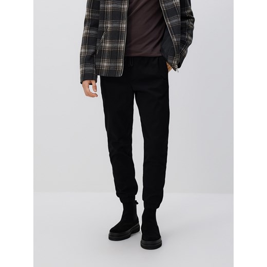 Reserved - Bawełniane spodnie jogger - czarny ze sklepu Reserved w kategorii Spodnie męskie - zdjęcie 187216960
