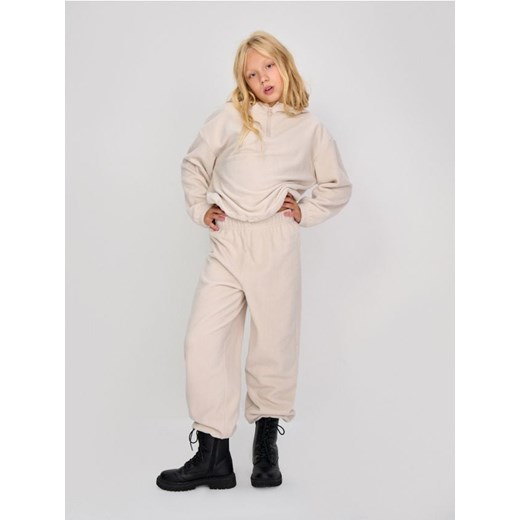 Sinsay - Polarowe spodnie ze ściągaczami - beżowy ze sklepu Sinsay w kategorii Spodnie dziewczęce - zdjęcie 187281994
