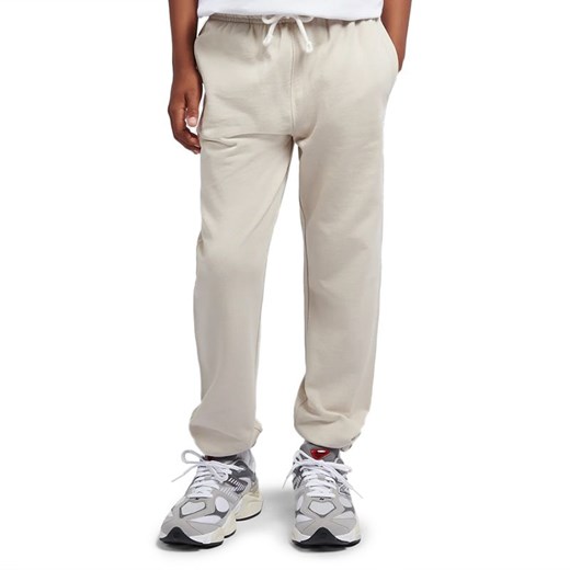 Spodnie dziecięce New Balance LAKB0060TWF - beżowe - id: 3241375 - marki New Balance - 187282003 Spodnie dziecięce New Balance LAKB0060TWF - beżowe ze sklepu streetstyle24.pl w kategorii Spodnie chłopięce - zdjęcie 187282003