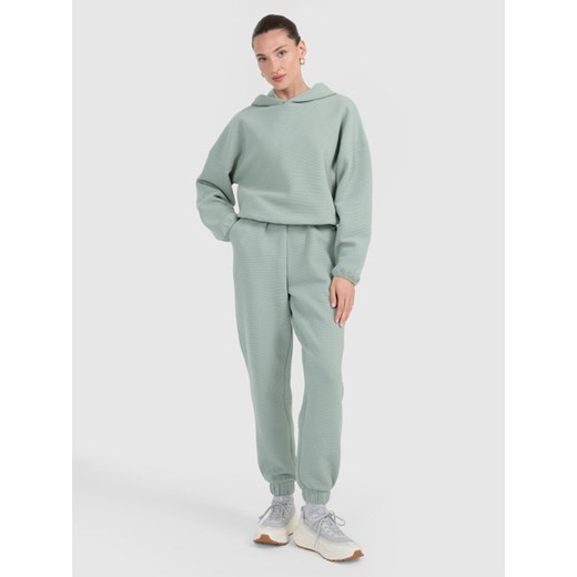 Damskie spodnie dresowe 4F 4FWAW25TTROF1184 - zielone ze sklepu Sportstylestory.com w kategorii Spodnie damskie - zdjęcie 187293562