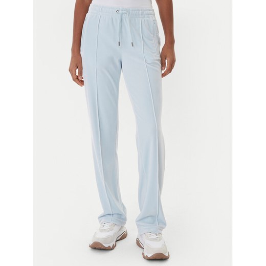 Juicy Couture Spodnie dresowe Tina JCWBJ225307 Błękitny Regular Fit ze sklepu MODIVO w kategorii Spodnie damskie - zdjęcie 187343342