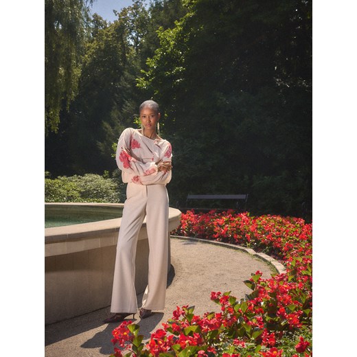 Mohito - Spodnie z szeroką nogawką - kremowy ze sklepu Mohito w kategorii Spodnie damskie - zdjęcie 187382323