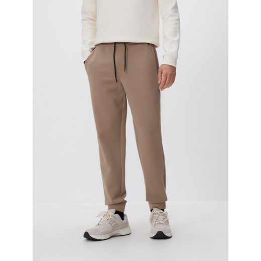 Reserved - Spodnie dresowe slim fit - beżowy ze sklepu Reserved w kategorii Spodnie męskie - zdjęcie 187497430