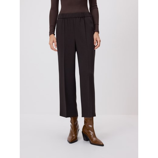 Reserved - Spodnie z kantem - ciemnobrązowy Reserved XL Reserved