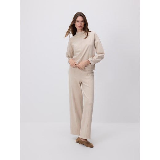 Reserved - Spodnie z przeszyciem - kremowy ze sklepu Reserved w kategorii Spodnie damskie - zdjęcie 187635901