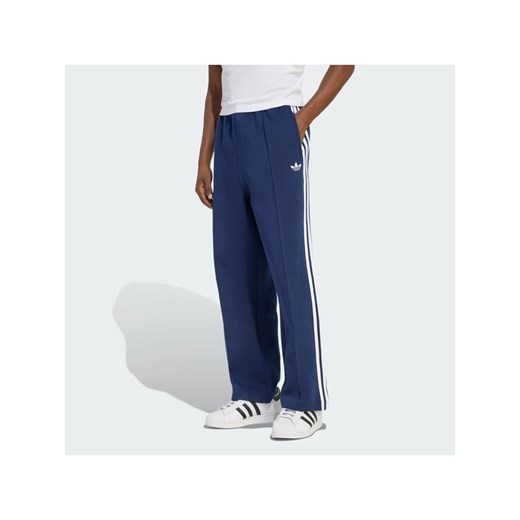 adidas Spodnie dresowe adicolor Spacer Track KD4087 Granatowy Baggy Fit ze sklepu MODIVO w kategorii Spodnie męskie - zdjęcie 187673300