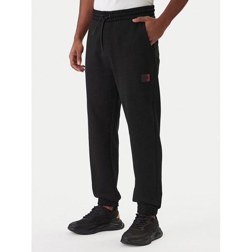 HUGO Spodnie dresowe Danopan 50553146 Czarny Relaxed Fit ze sklepu MODIVO w kategorii Spodnie męskie - zdjęcie 187803064