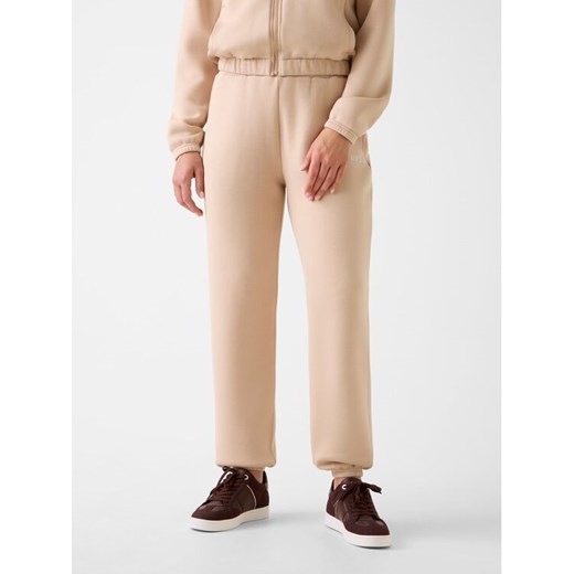 Guess Spodnie materiałowe 169841 Beżowy Slim Fit Guess XXS MODIVO