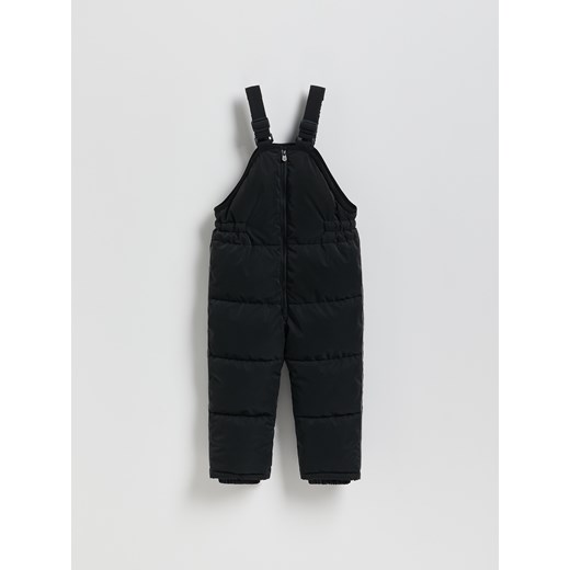 Reserved - Gumowane spodnie na szelkach - czarny ze sklepu Reserved w kategorii Spodnie dziewczęce - zdjęcie 187932850
