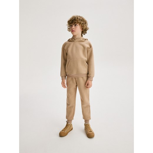 Reserved - Dresowe spodnie jogger - beżowy ze sklepu Reserved w kategorii Spodnie chłopięce - zdjęcie 187957504