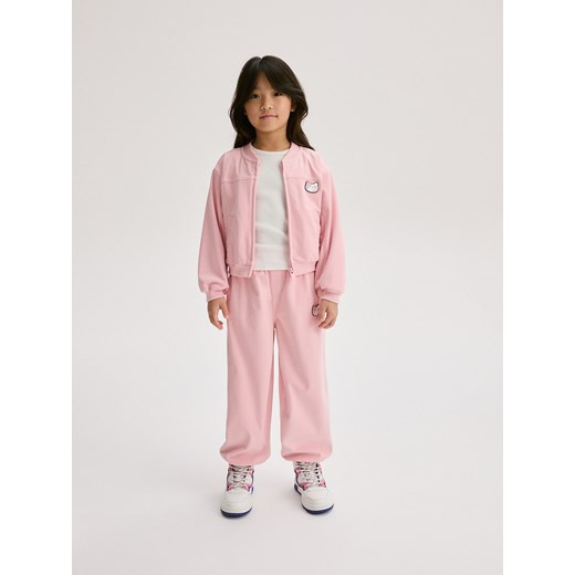 Reserved - Spodnie dresowe z aplikacją - różowy ze sklepu Reserved w kategorii Spodnie dziewczęce - zdjęcie 188001360