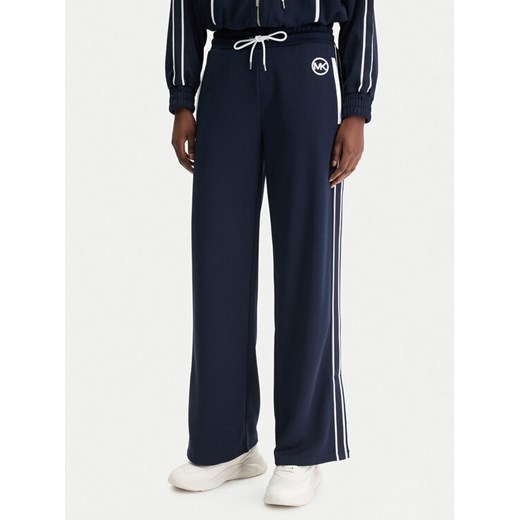 MICHAEL Michael Kors Spodnie dresowe MR630Y0K8N Granatowy Regular Fit ze sklepu MODIVO w kategorii Spodnie damskie - zdjęcie 188007631