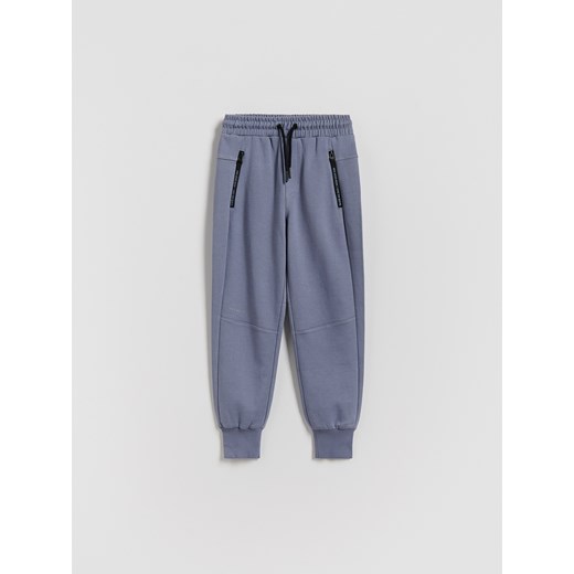 Reserved - Bawełniane spodnie jogger - niebieski ze sklepu Reserved w kategorii Spodnie chłopięce - zdjęcie 188067653