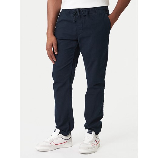 Tommy Jeans Joggery DM0DM23102 Granatowy Regular Fit ze sklepu MODIVO w kategorii Spodnie męskie - zdjęcie 188074522