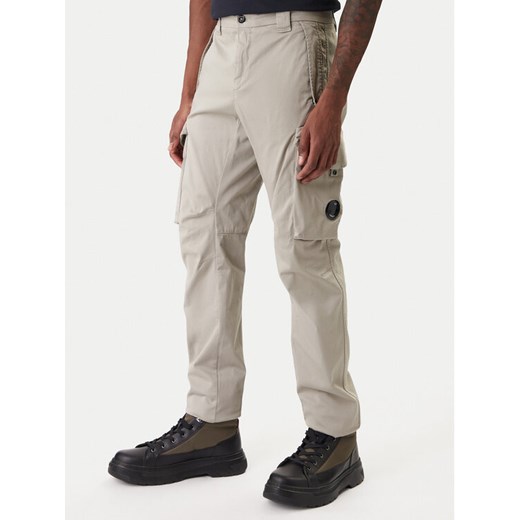 C.P. Company Spodnie materiałowe 20CMPA744A005694G Beżowy Regular Fit ze sklepu MODIVO w kategorii Spodnie męskie - zdjęcie 188075024