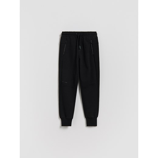 Reserved - Bawełniane spodnie jogger - czarny ze sklepu Reserved w kategorii Spodnie chłopięce - zdjęcie 188090504